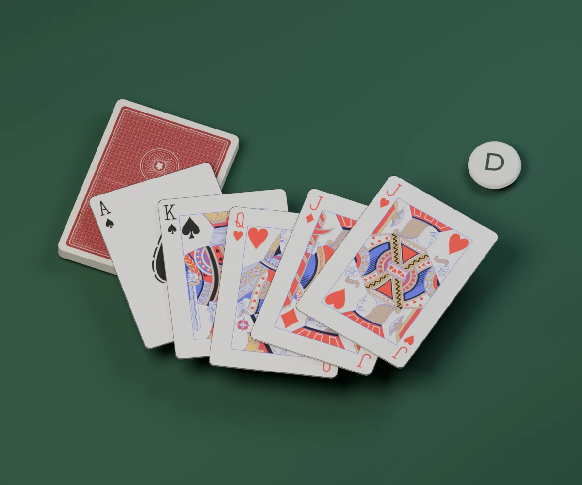 Classic playing cards and a dealer button on a green felt table, with both red jacks at the front